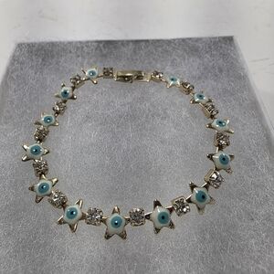 Gold Star and Evil Eye Bracelet With Crystals